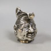 An Edwardian novelty silver 'character' cream jug, Williams Ltd, Birmingham, 1905, 93mm, 100 grams.