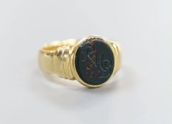 A George V 18ct gold and bloodstone set signet ring, the stone with engraved initials, size M, gross