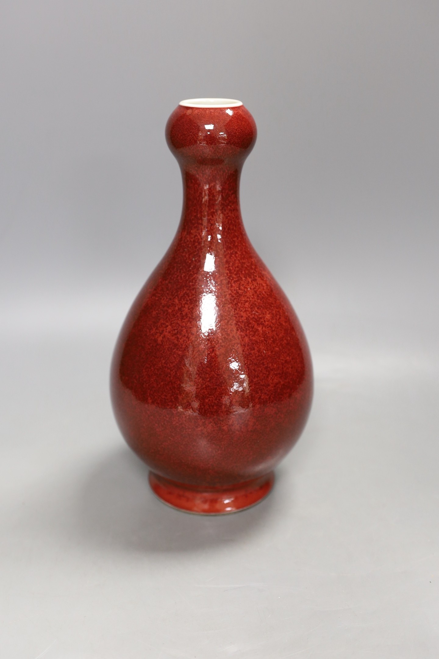 A Chinese sang de boeuf glazed vase 26 cms high.