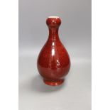 A Chinese sang de boeuf glazed vase 26 cms high.