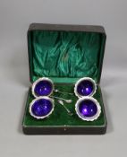 A cased set of four silver salts and four associated spoons, including plated.