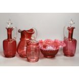 A pair of cranberry glass decanters, a jug, a fluted vase and a biscuit box and cover- decanters and