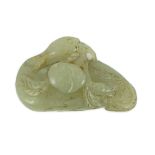 A Chinese pale celadon jade carving of a duck, possibly Jin-Yuan dynasty its head turned backward