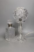 A cut glass globe table lamp and a similar silver collared decanter- lamp 41 cms high.
