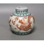 A Chinese doucai jar and cover, 12 cms high.