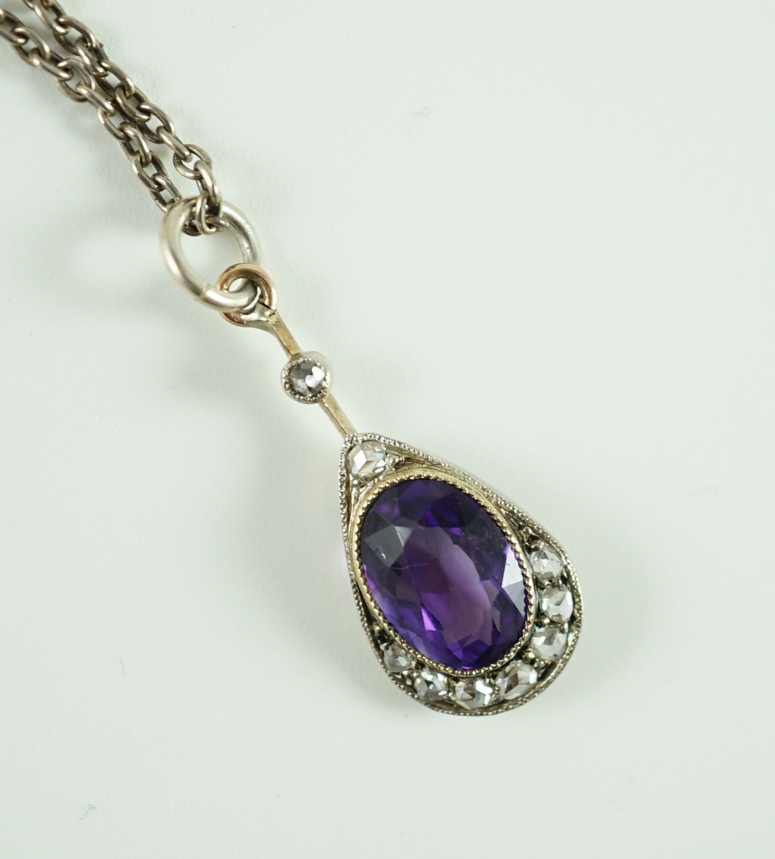 A Victorian gold and silver, amethyst and diamond set teardrop shaped pendant, 24mm, on a fine - Image 2 of 2