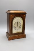 A late 19th century rosewood and marquetry mantel clock, 36 cms high.