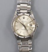 A gentleman's 1980's stainless steel Rolex Oyster Perpetual Date wrist watch, on an associated