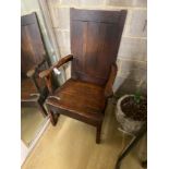 An 18th century Provincial oak wood seat open armchair, width 68cm, depth 64cm, height 113cm