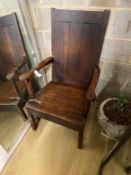 An 18th century Provincial oak wood seat open armchair, width 68cm, depth 64cm, height 113cm