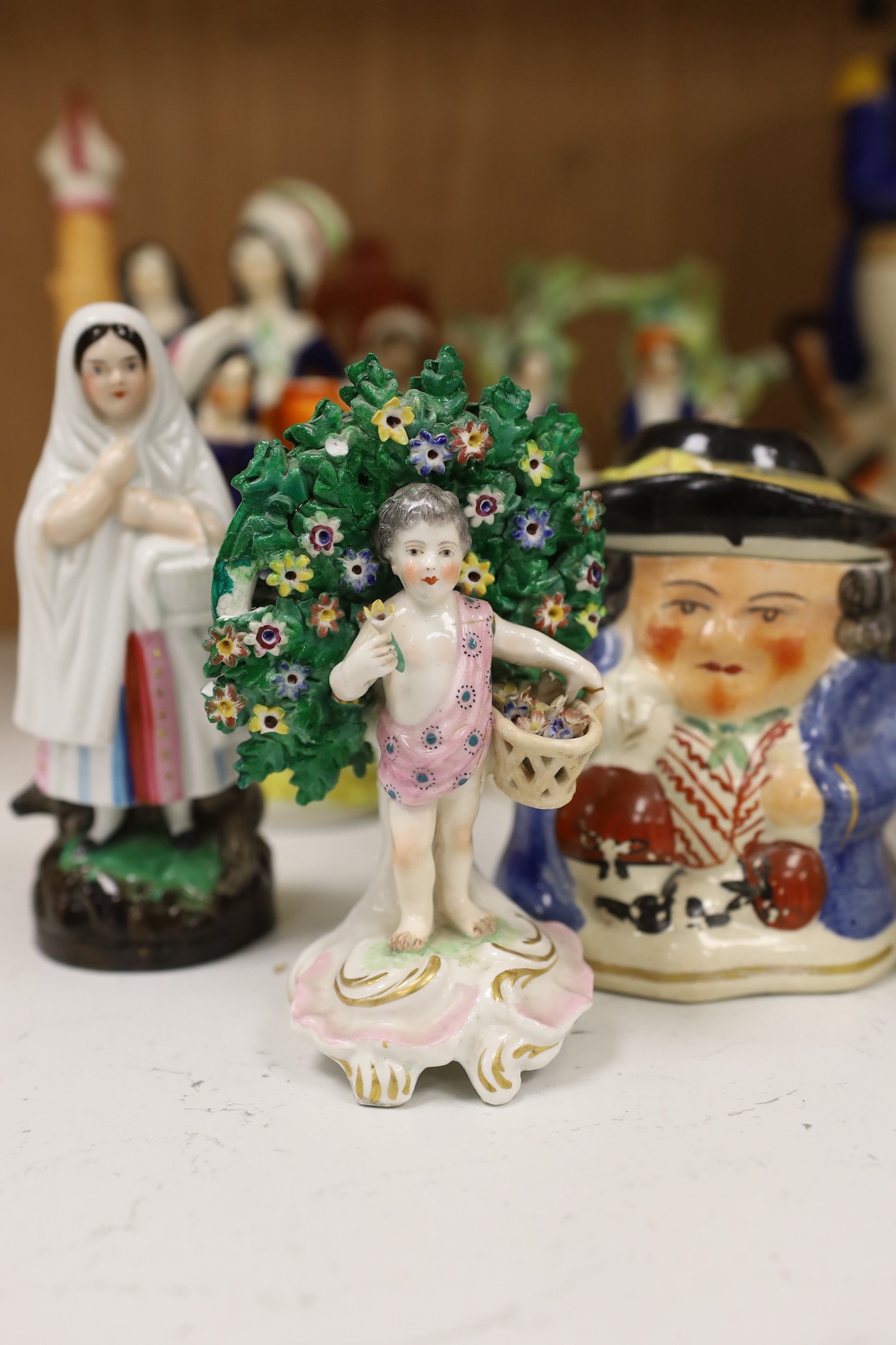A large group of Staffordshire pottery figures and groups and figural cruets, to include a Nelson - Image 3 of 5