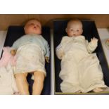 An Armand Marseille bisque doll and a composition doll-bisque headed doll 58 cms high.