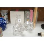 A pair of spirit decanters and a boxed pair of novelty Stuart 'rest' decanters.