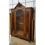 An early 20th century French glazed walnut vitrine, width 160cm, depth 48cm, height 250cm