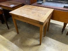 A 19th century French provincial oak farmhouse table with rectangular folding top on square