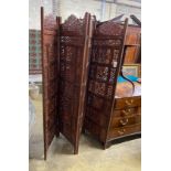 An Indian carved hardwood four fold screen, each panel width 51cm, height 183cm