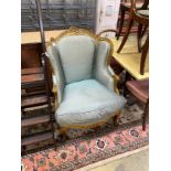 A Louis XV style carved giltwood fauteuil, width 70cm, depth 70cm, height 102cm