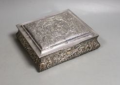An Edwardian embossed silver mounted rectangular bombe shaped jewellery casket, Henry Matthews,