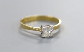 A modern 18ct gold and princess cut solitaire diamond set ring, size O/P, gross weight 2.2 grams,