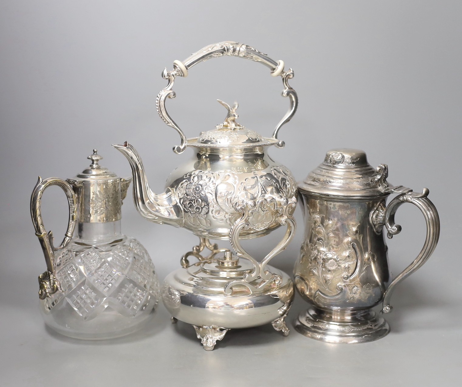 A silver plated tea kettle, burner and stand, ceramic insulators, 33 cm high a mounted claret jug - Image 2 of 2