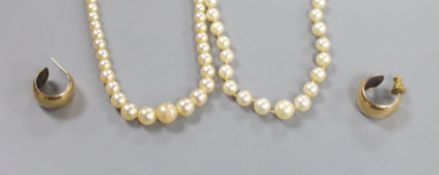 A single strand cultured pearl necklace, with 9ct clasp, 54cm, a simulated pearl necklace and a pair