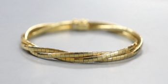A modern three colour 9ct gold triple strand interwoven bracelet, 17cm, 15.3 grams.