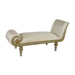 A Regency white painted and parcel gilt chaise longue, decorated throughout with foliate motifs,