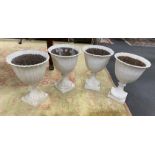 A set of four Victorian painted cast iron garden urns, diameter 38cm, height 53cm