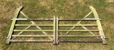 A pair of weathered English oak five bar gates, each gate 167cms (total span touching 334cms).