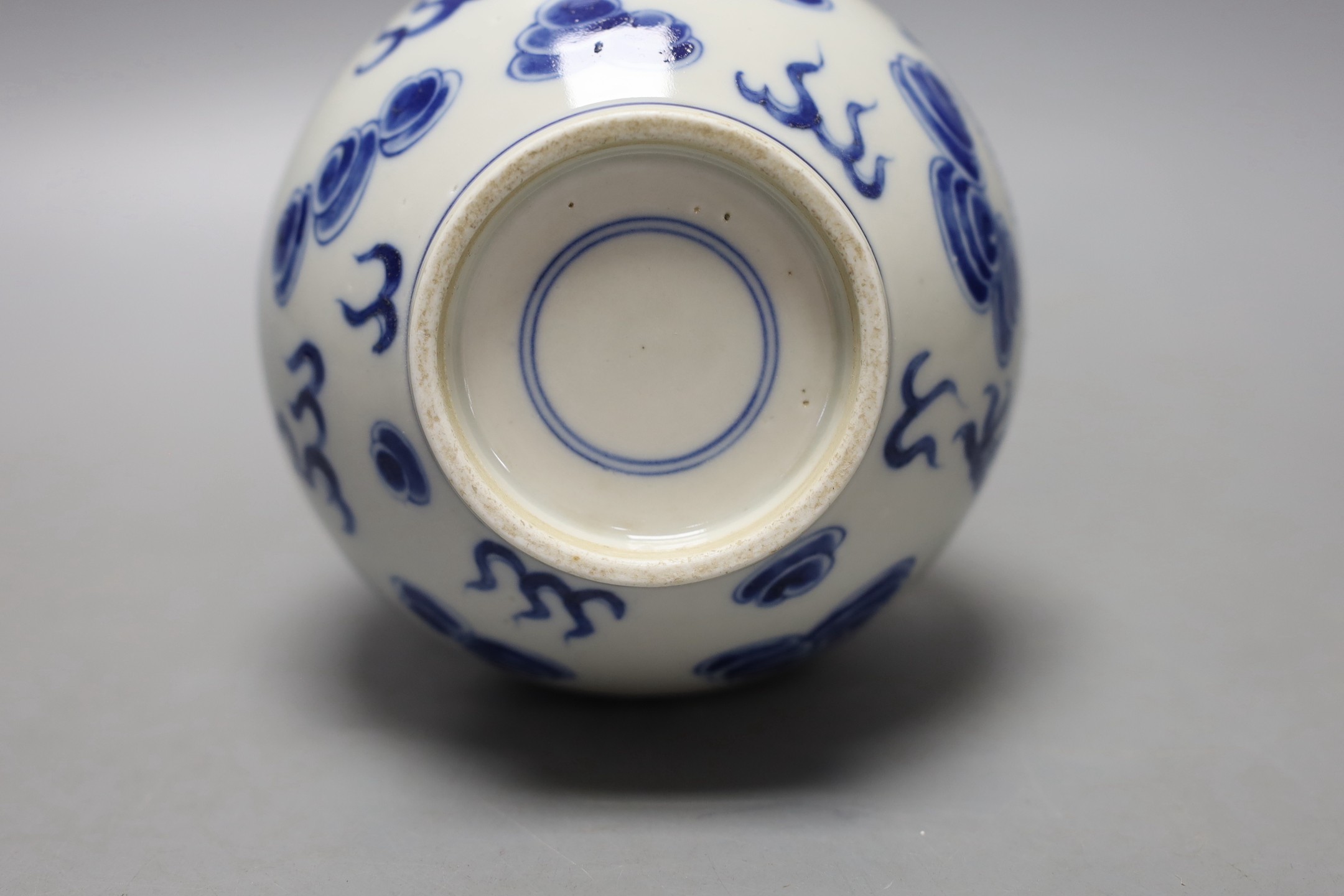 A Chinese blue and white ‘dragon and phoenix’ bottle vase, 23 cms high. - Image 3 of 3