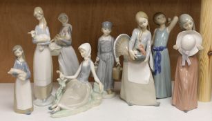 A collection of eight various Lladro figure groups to include a girl with lamb, a seated girl,