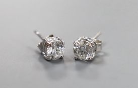 A pair of modern 750 white metal and solitaire diamond set ear studs, gross weight 1.9 grams,
