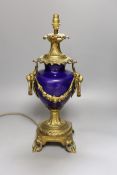 A 19th century gilt mounted urn shaped table lamp, 36 cms high.
