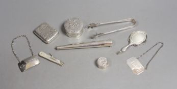 A 9ct gold cased propelling toothpick and nine other small silver or white metal items including