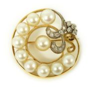 A 20th century gold, cultured pearl and diamond set open work scroll brooch, 29mm, gross weight 11.1