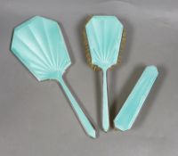 A George VI silver and green guilloche enamel three piece mirror and brush set, Daniel Manufacturing