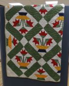 An American style multi coloured patchwork quilted cover-170 cms long x 168 wide.