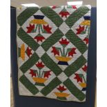 An American style multi coloured patchwork quilted cover-170 cms long x 168 wide.