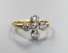 An 18ct and collet set five stone diamond 'cross' ring, size O, gross weight 3 grams.