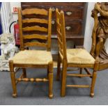 A good set of twelve reproduction Belvedere Furniture light oak ladderback dining chairs with drop