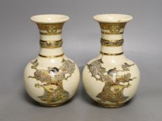 A pair of Japanese Satsuma vases, signed, 17 cms high.