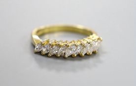 A modern 18ct gold and nine stone marquise cut diamond set half hoop ring, size O, gross weight 4.