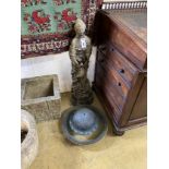 A reconstituted stone figural garden ornament, height 80cm together with a pottery bird bath