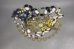 A quantity of assorted costume jewellery including necklaces, bracelets etc.