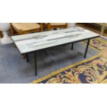 A 1950's wrought iron rectangular tiled top coffee table with geometric design, length 122cm,