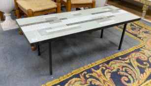 A 1950's wrought iron rectangular tiled top coffee table with geometric design, length 122cm,