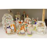 A group of Staffordshire pottery and porcellaneous figures and groups, The tallest 42 cm