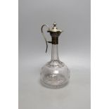 A Victorian plated mounted glass claret jug with patent designed pouring system, 25cm