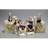 A pair of 19th century Staffordshire sheep and children groups and three Staffordshire pottery and