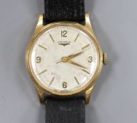 A gentleman's 1960's 9ct gold Longines manual wind wrist watch, with case back inscription, case